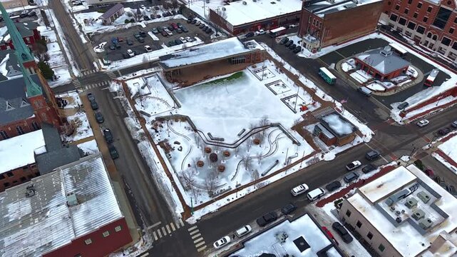 Aerial footage of Downtown Commons and a neighboring bus depot located in downtown Clarksville Tennessee in winter