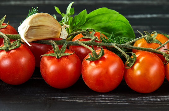 Healthy food background. Healthy food concept, fresh vegetables. On a black wooden background. Side view. Selective focus