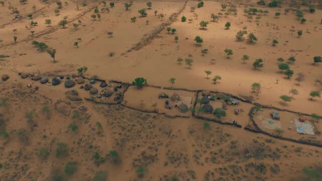 Aerial view of traditional villages and small camps in arid Thar Desert landscape