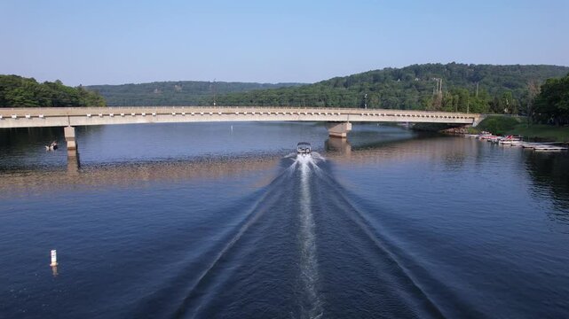 Rising drone shot of pontoon on deep creek lake maryland
