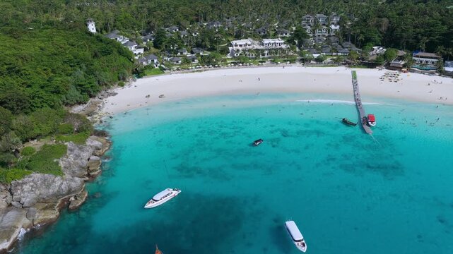 Racha Beach in Phuket Thailand during summer with boats underneath