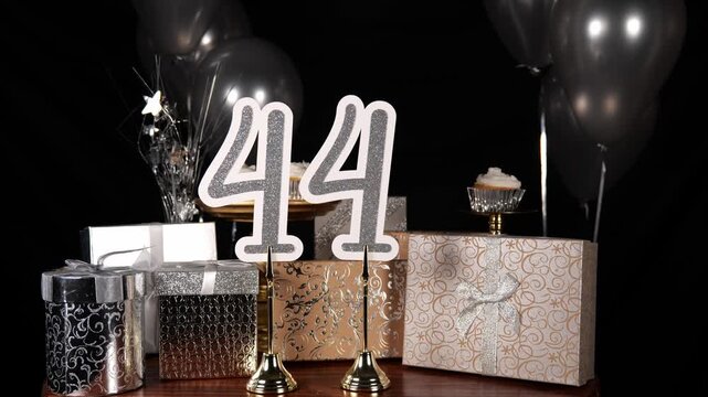 Silver Number 44 with Silver Glitter Sparkles with Gifts and Balloons and Cupcakes for Party Forty Four
