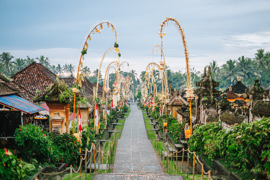 Balinese Penjor Decorations Along Paved Pathway, Bali, Indonesia