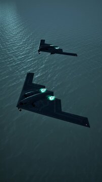 Vertical view of B-2 stealth bomber aircraft flying at high speed over ocean water, strategic air force concept, 3D animation