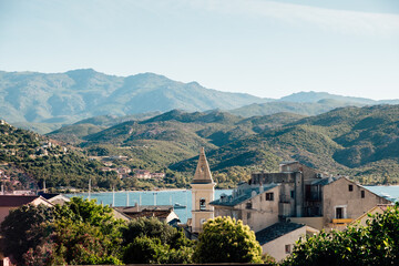 Obraz premium View of the montains over the roofs of Saint-Florent in Corsica