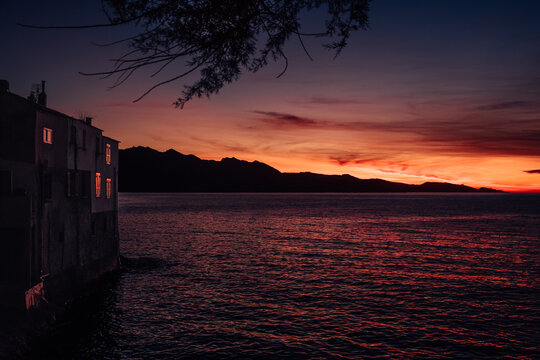 Wonderful colorful sunset reflecting in the sea in Saint-Florent in Corsica