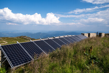High mountain solar power system with panoramic view of valley and peaks © Tetiana Tuzyk