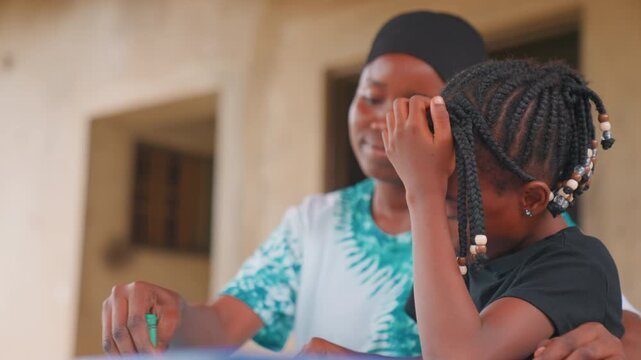 African mother comforting daughter in moment, black mother providing solace on home porch, tender gesture and reassuring voice, daughter adjusting braided hair while receiving comfort, intimate