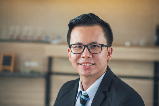Portrait asian businessman confidence smile arm crossed standing. Happy salesman in Trendy suit formal fashion studio shot. One man standing successful executive. Relax professional manager men