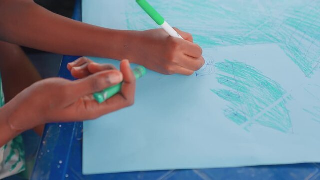 Parents and Kid Create Together. Mother and Child Collaborate on Artwork Outdoors in Bright Sunlight. Mother and her child participate in cheerful outdoor art activity under clear skies