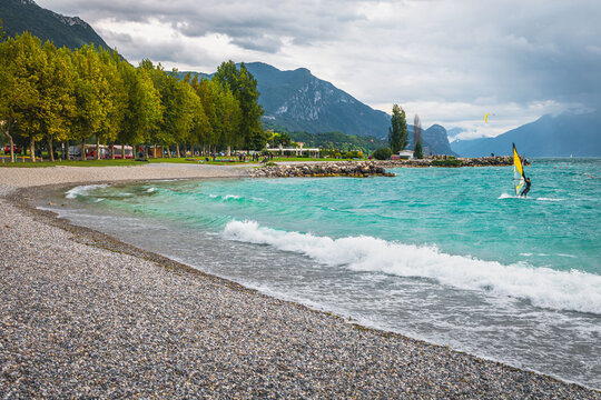 Big wave and surfer on the Lake Garda, Lombardy, Italy