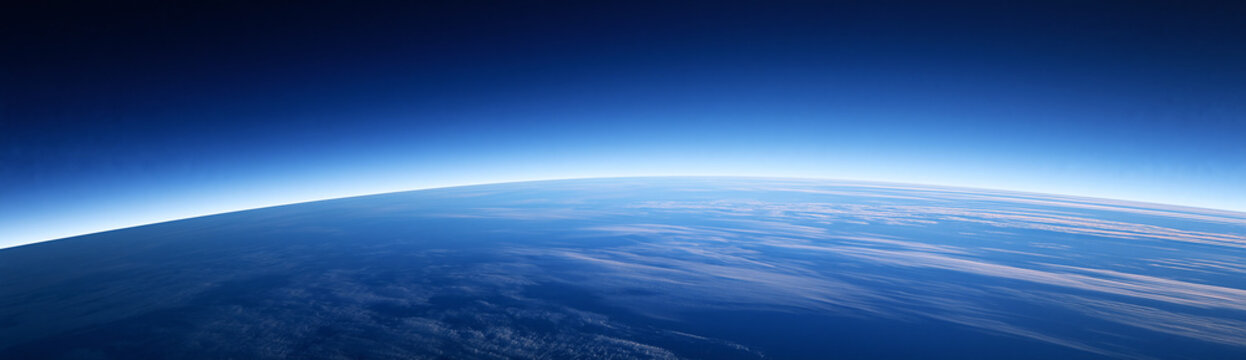 Panoramic cloudless blue sky transitioning from rich blue overhead to lighter blue near the horizon, soft natural gradient, pristine atmosphere, minimalist stock background, highly realistic