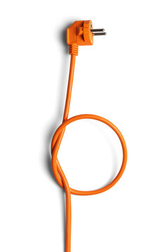 Orange power cable with plug tied in a knot isolated on white background, vertical