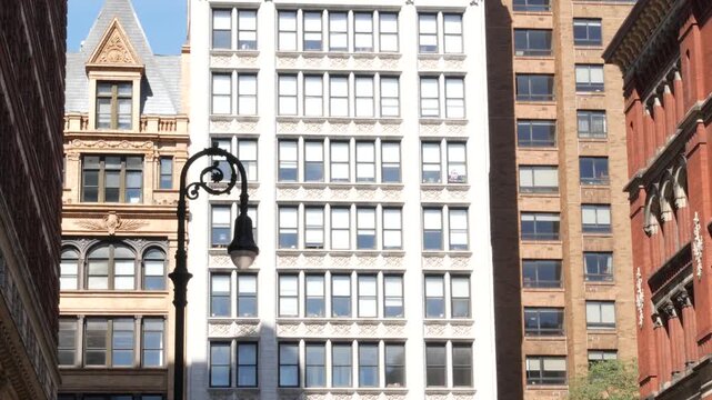 New York City urban buildings architecture, Manhattan Broadway street United States of America. Red brick classic house, USA. Typical old historic real estate property in NYC.