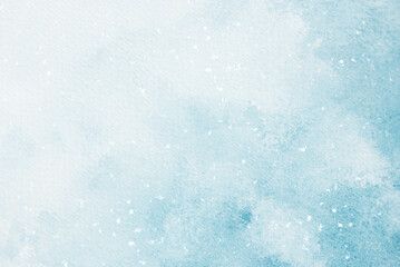 Fototapeta premium A blue watercolor background with falling snow for designing winter holiday web banners