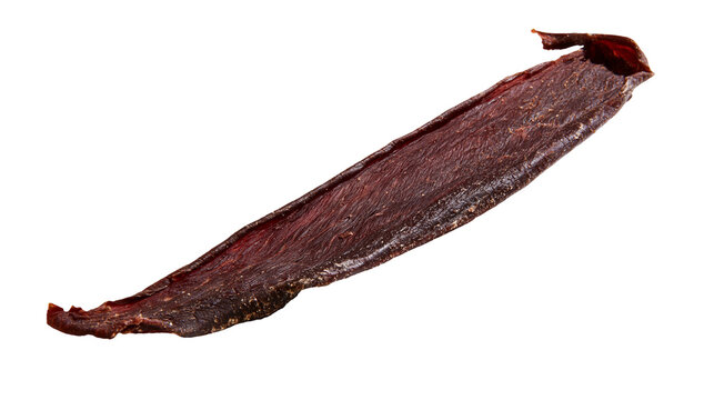 Thin strip of dried beef jerky with dark red color and textured surface