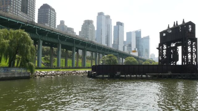 New York City Riverside Park South Manhattan United States. Modern residential building Upper West Side. Urban skyscraper skyline. Miller highway remnant, elevated viaduct. Industrial gantry dock pier