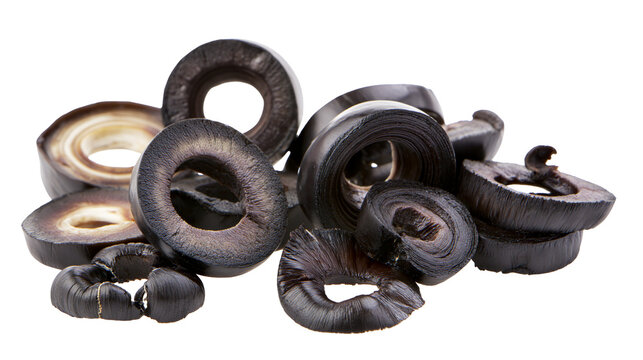 Sliced black olives pile, dark purple fruit rings