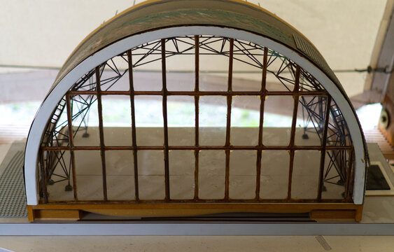 Architectural model of an arched railway station or hangar with a glass facade