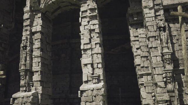 tight perspective on arched openings and rough blockwork capturing shadowed recesses, chipped edges and vertical joints, raw tactile surface conveying long