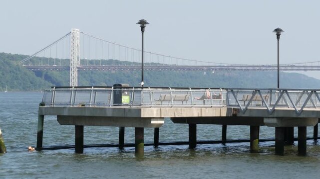 George Washington bridge, Hudson river in New York City, United States of America. Transport bridge architecture, riverside park pier in West Harlem. Waterfront promenade near river water. USA nature.