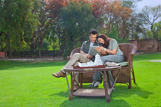 Couple looking at a digital tablet