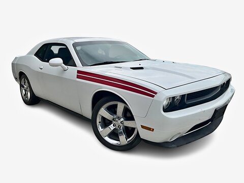 White Dodge Challenger muscle car with red racing stripes