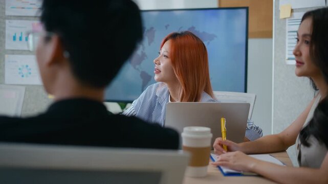 Group of young asian creative business brain storm meeting presentation,discussing roadmap to product launch, planning,strategy,new business development,working with new startup project in office.
