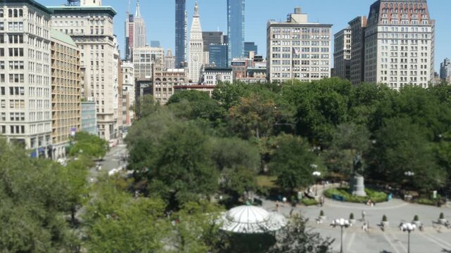 New York City Manhattan Midtown Union Square on Broadway street, United States of America. Old historic building urban architecture from above. Cityscape skyline and summer greenery in park. People.