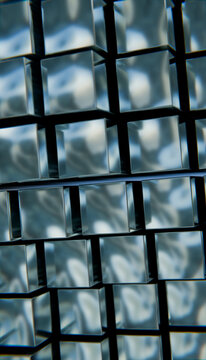 Close-up view of stacked transparent glass cubes creating an abstract