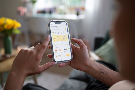 White Woman using a food ordering app