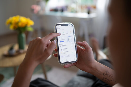 White Person using remote healthcare app on smartphone working