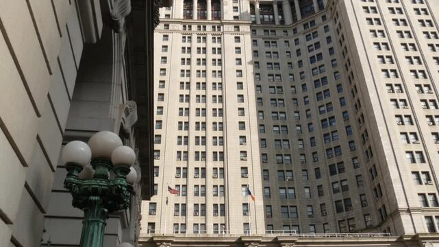 New York City Downtown Civic Center, United States of America. Manhattan municipal building 1914, old historic architecture. Government administration authority. Low angle view from Chambers street.