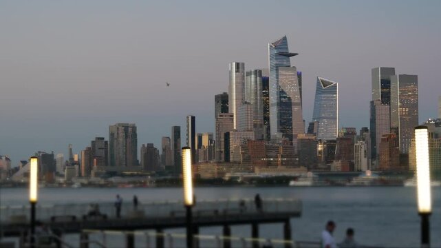 New York City Manhattan Midtown skyline, Chelsea and Hudson Yards towers from New Jersey, Hoboken pier, United States. River waterfront urban cityscape with skyscraper buildings, Evening dusk twilight