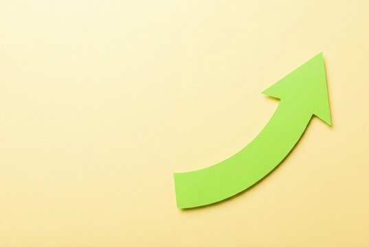 Bright green upward trending arrow symbolizing growth and success on light background