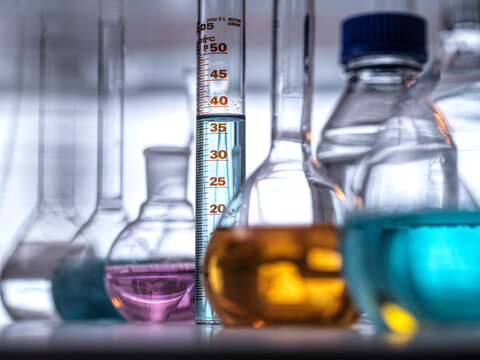 Colorful liquid fills lab glassware during a chemistry experiment