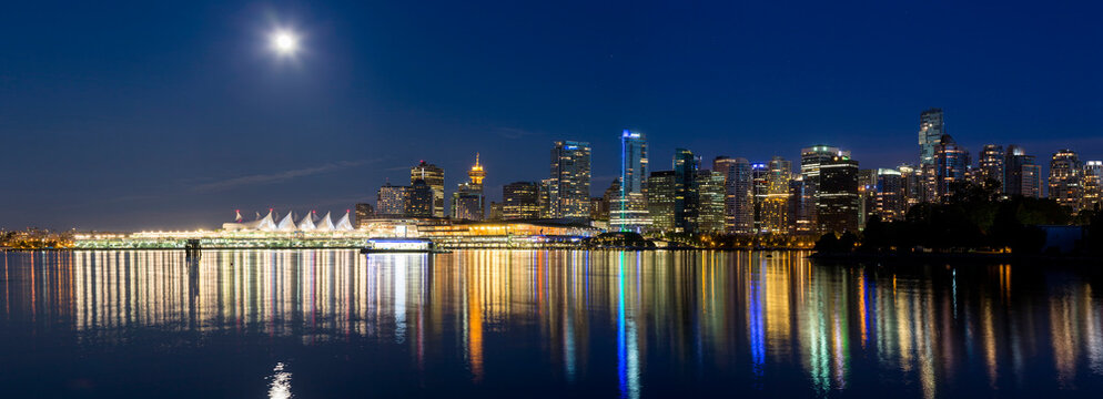 Canada, British Columbia, Vancouver, View of city skyline at night with full moon