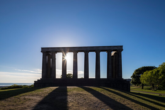 Great Britain, Scotland, Edinburgh, Calton Hill, National Monument of Scotland against the sun