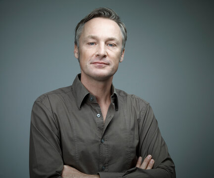 Portrait of man with crossed arms