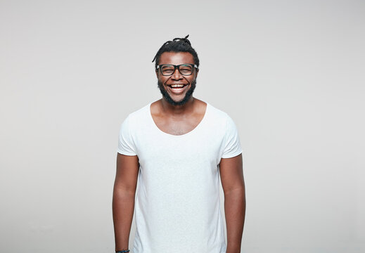 Portrait of laughing man wearing glasses and white t-shirt