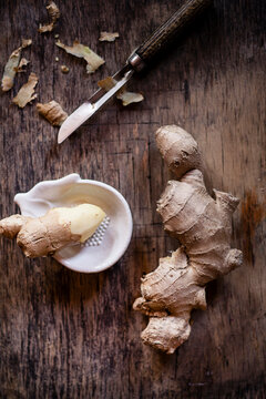 Fresh ginger with peeler and grater