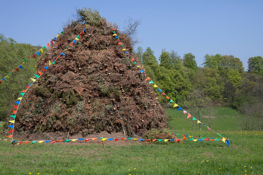 Germany, North Rhine-Westphalia, Detmold, Woodpile for easter fire, decorated with pennants
