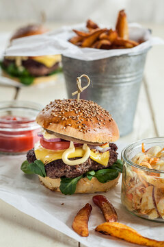 Homemade cheeseburger, coleslaw and french fries