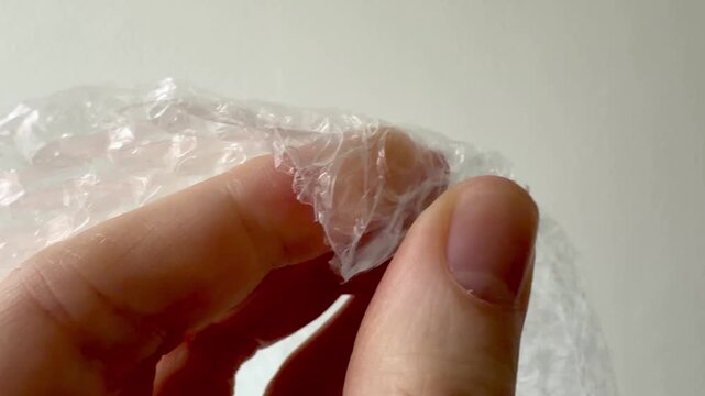 Fingers Popping Bubble Wrap Close-up Stress Relief Concept