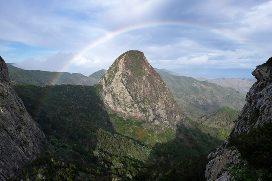 Spain, Canary Islands, La Gomera, Garajonay National Park, rainbow over Roque de Ojila