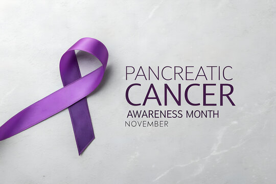 Purple awareness ribbon for pancreatic cancer awareness month in november