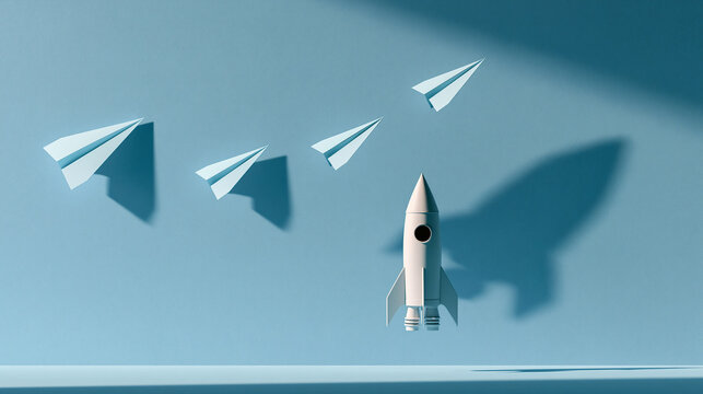 A small white rocket model taking off against a light blue background casting a large shadow on the wall surrounded by several flying paper airplanes airplane