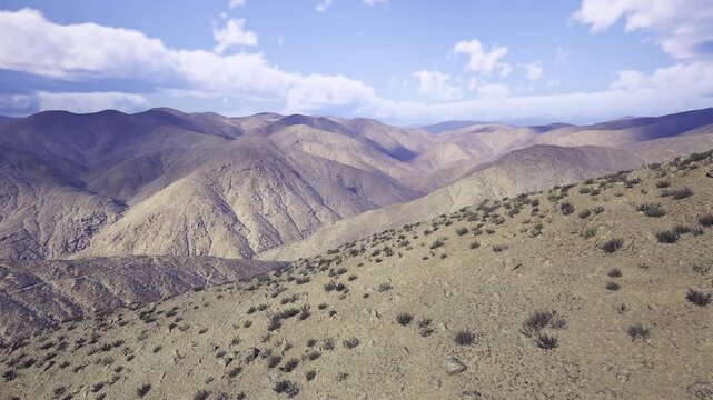 Textured geological contours in Nepal hills visible strata and erosion patterns, sparse vegetation accentuating fold lines and ravines, ideal for geology,