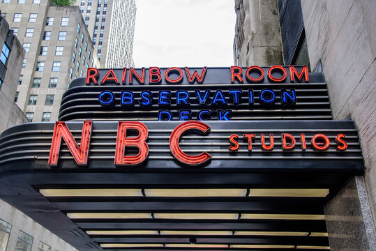 New York, New York, USA - June 14, 2026: A close-up street-level view of the sign outside Rockefeller Plaza in Midtown Manhattan. The sign points visitors toward the Top of the Rock
