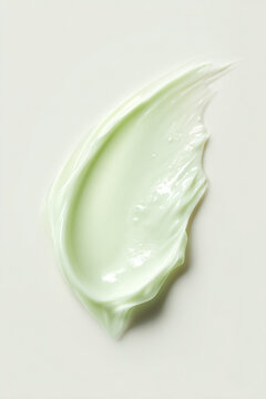 Cream streak showing a light green cosmetic product, highlighting its rich, smooth texture for health and beauty concepts